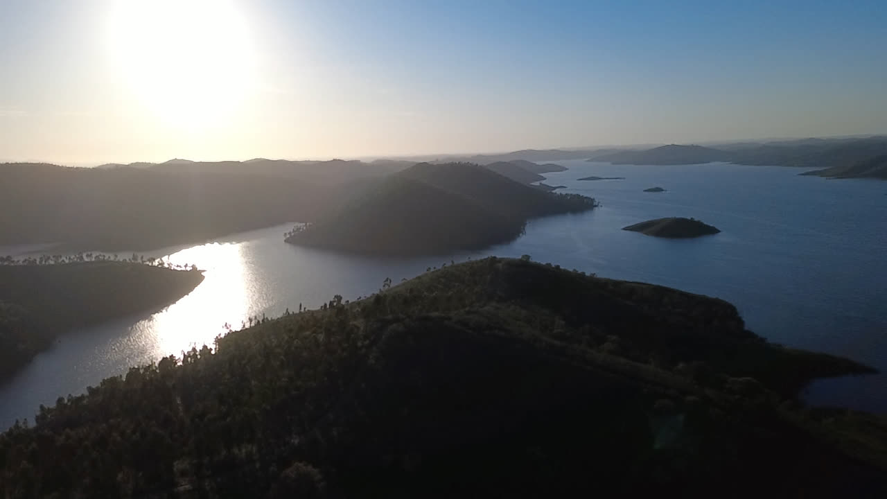 Islands and low sun over the reservoir.